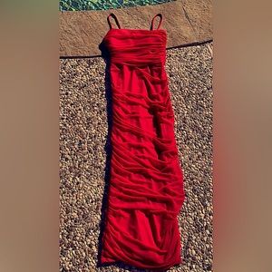 It’s a tight red dress with bra pads inside,it’s soft. The dress is from Windsor